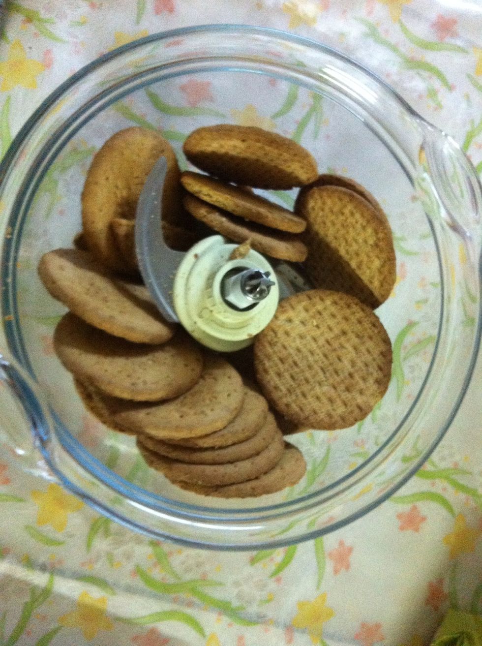 Put the digestive biscuits in a food processor and pulvarize!
