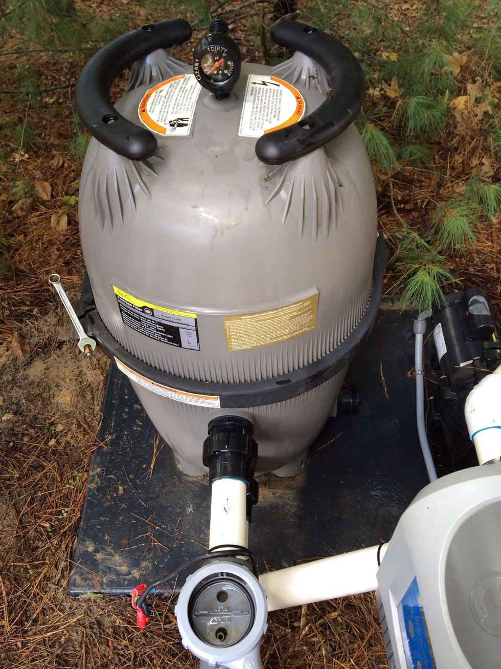 Put the dome back on making sure that your pressure filter is facing forward and replace the steel band