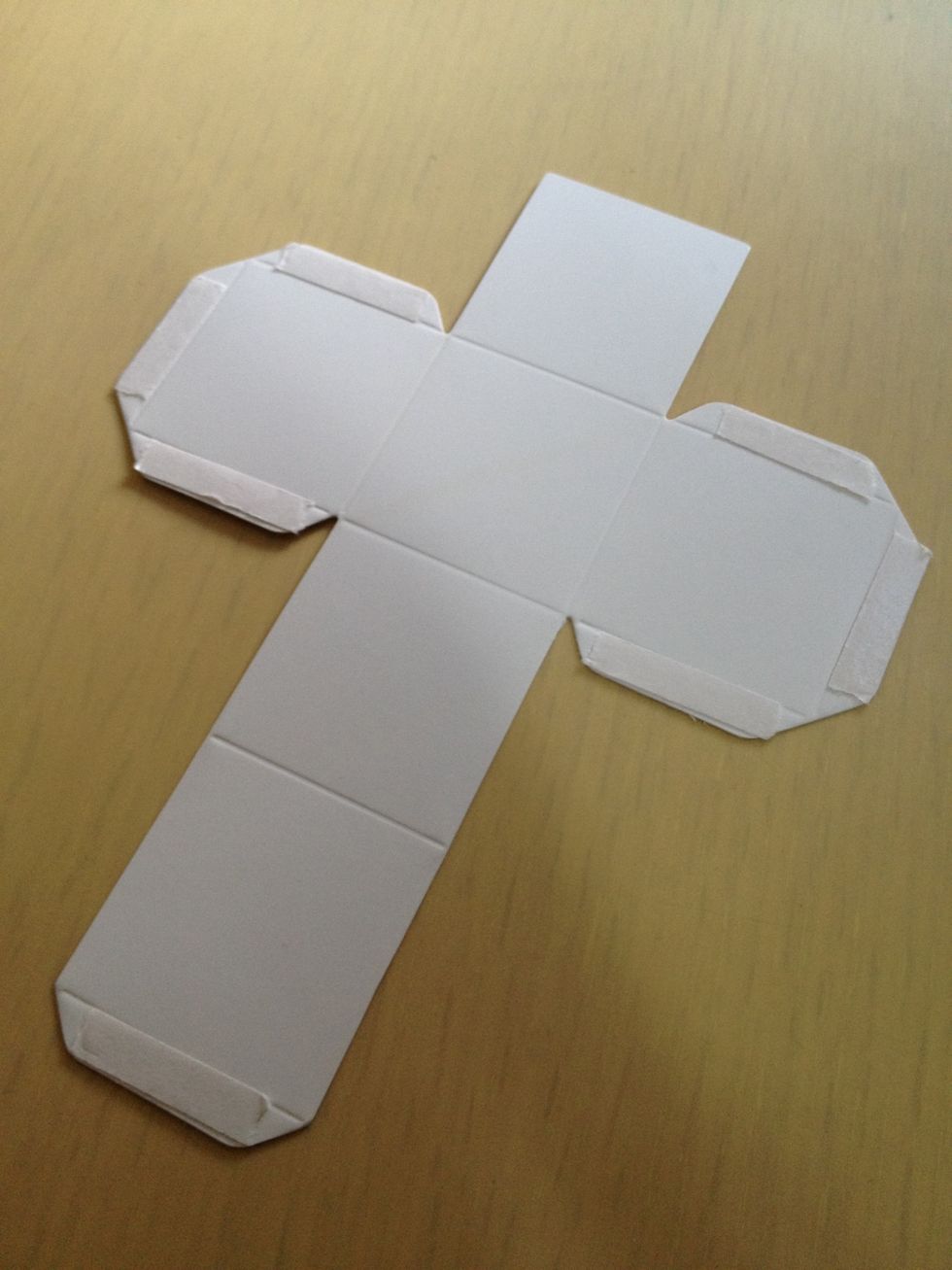 Put the double side tape on the edges of the visual art playing block paper.