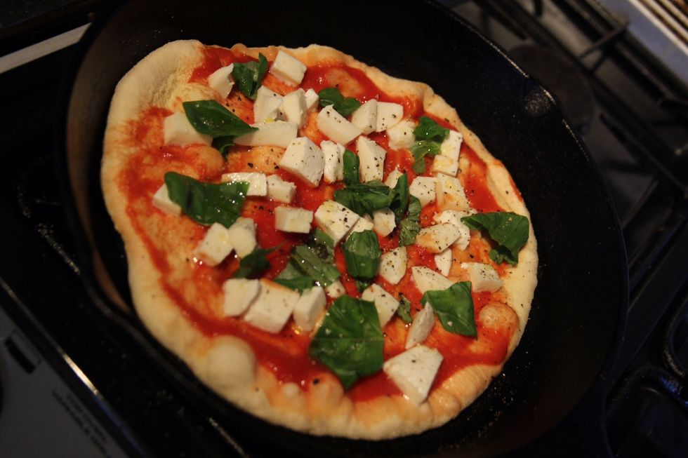 Put the dough into the pan and add around 2tblsp of passatta, about half a chopped ball of mozzarella and your toppings. After a further minute check to see if base is charred and pop under grill.