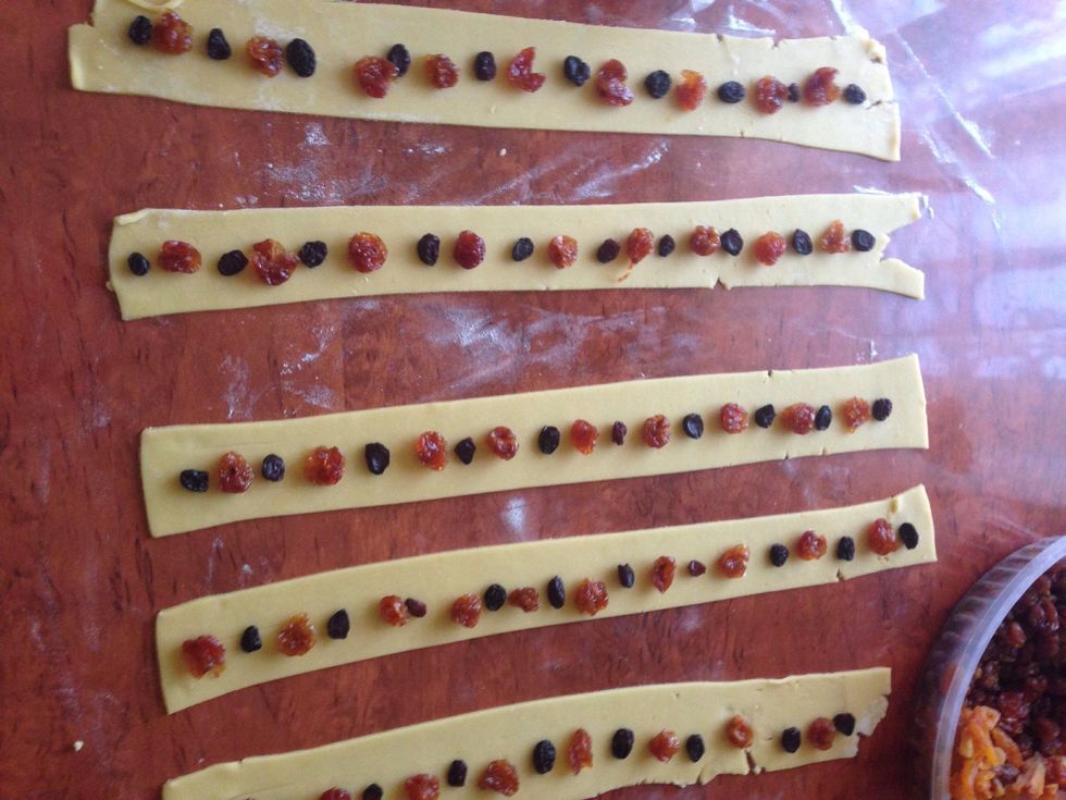 Put the dried fruit in one line( mine are cherries , but you can use whatever fruit u like