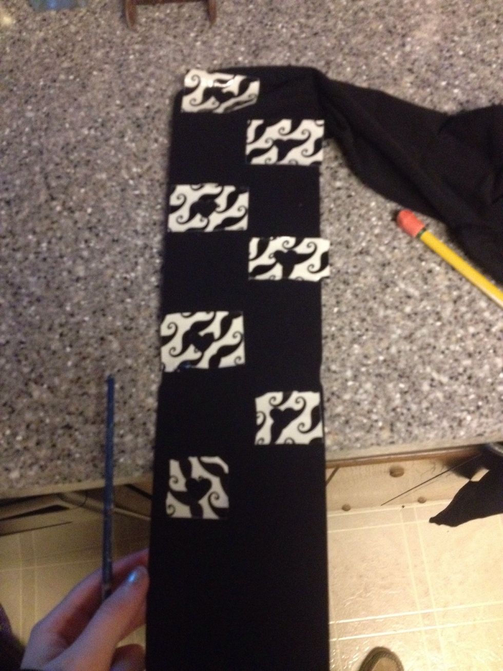 Put the duct tape in a pattern you like. You can leave a foot size section unpainted because it would probably be covered, or rub off. Also make sure the tape is completely flat on the tights.