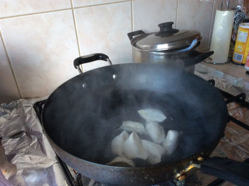 Put the dumpling in, then put the lid on and wait until it boils.