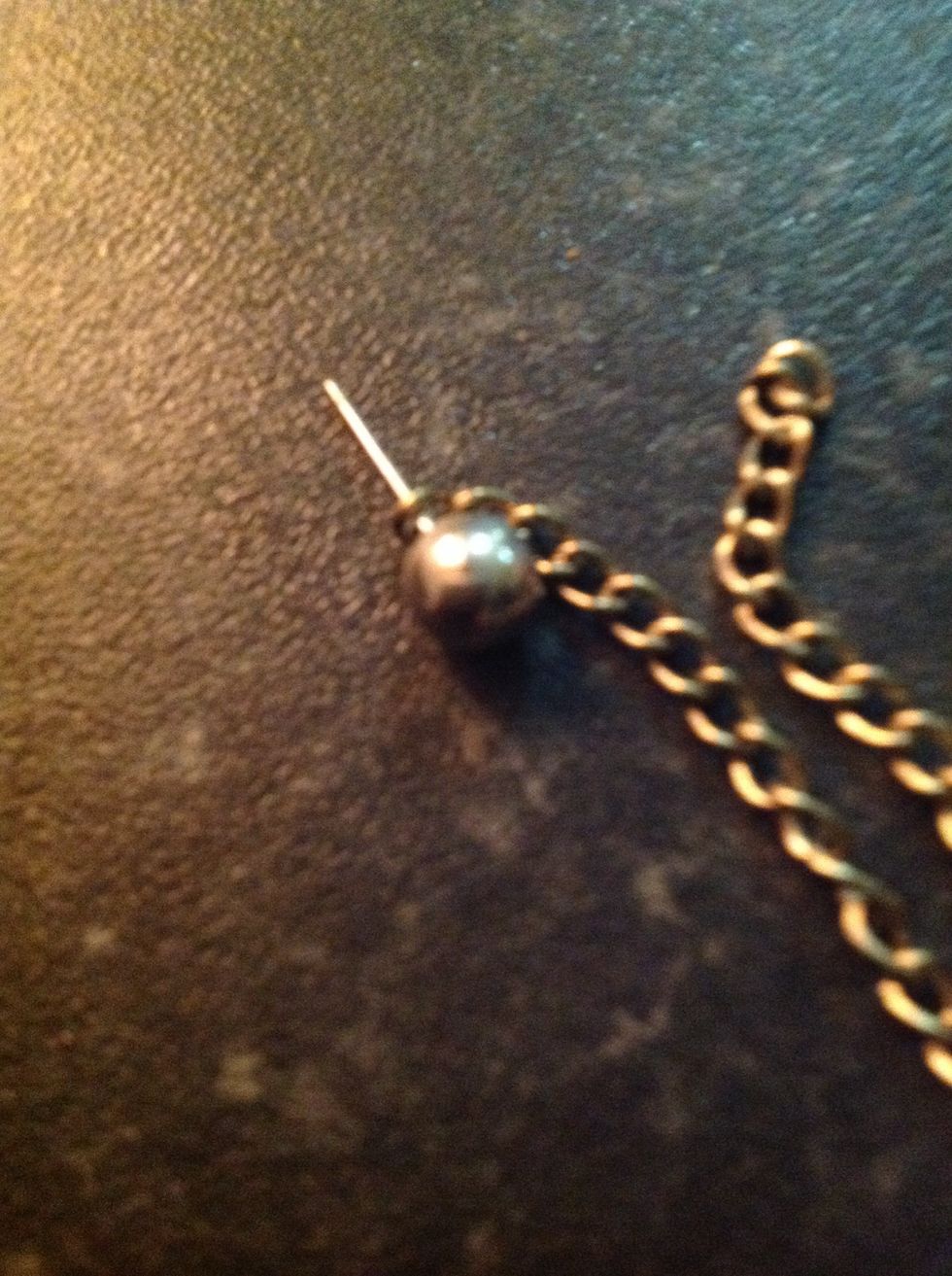 Put the earing through one of the end hoops