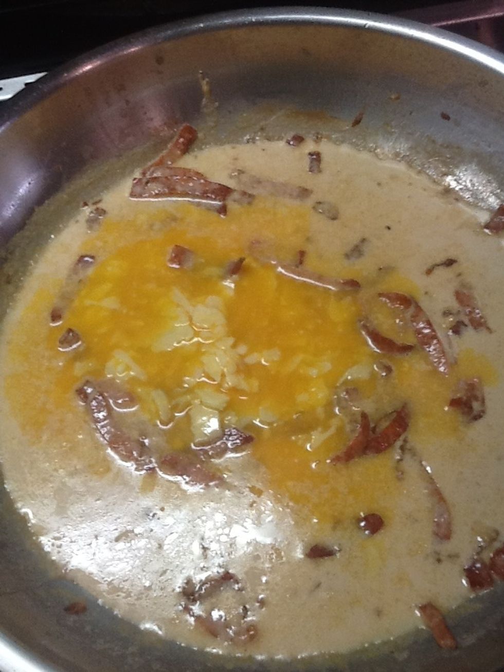 Put the egg and cheese mixture in with the bacon and evaporated milk