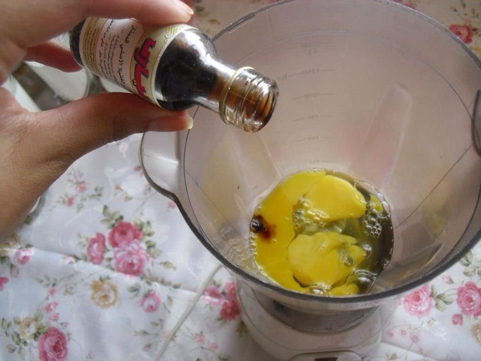 Put the egg in a blender then add vanilla