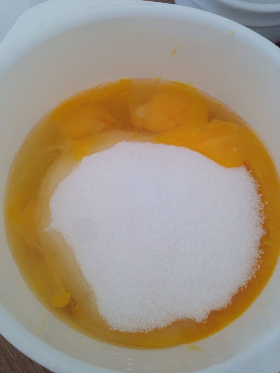 Put the eggs and sugar into a big bowl.