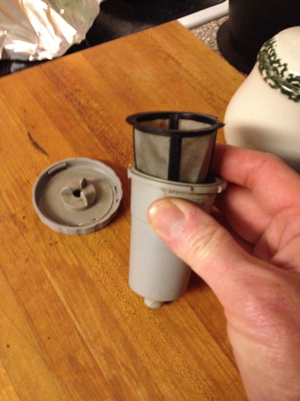 Put the empty filer in the holder.