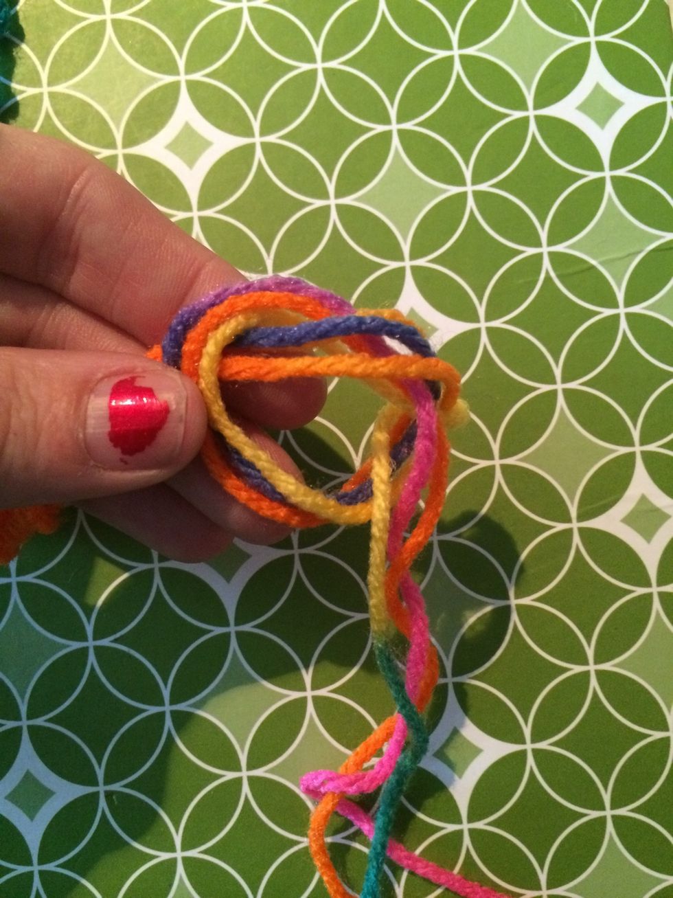 Put the end of the strings through the loop and make your ending knot.