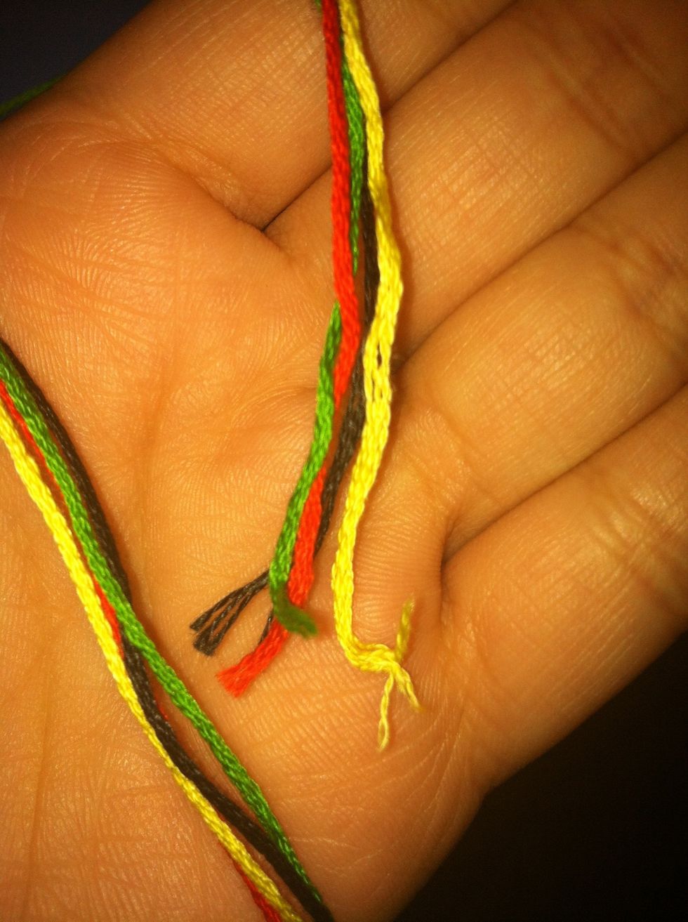 Put the ends of each of your colors together and measure out the desired amount of string. I usually cut about 24 inches... Which may be a bit much. Ah well.