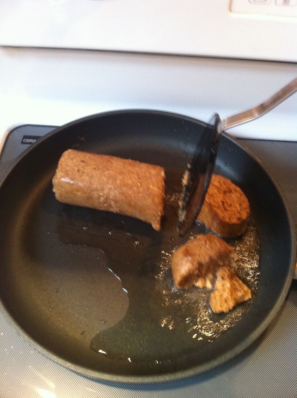 Put the entire pound of sausage in a frying pan with some hot oil and start breaking it up with your spatula. (Faux veggie sausage pictured here; use whichever you prefer.)