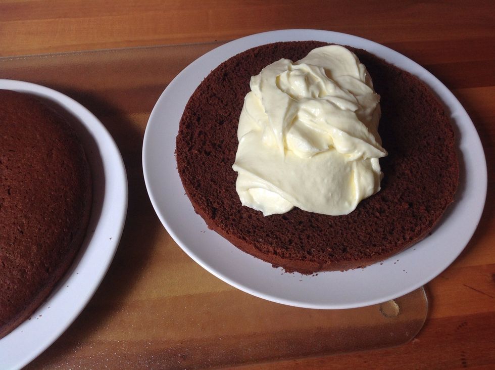 Put the filling on the bottom layer or the cake