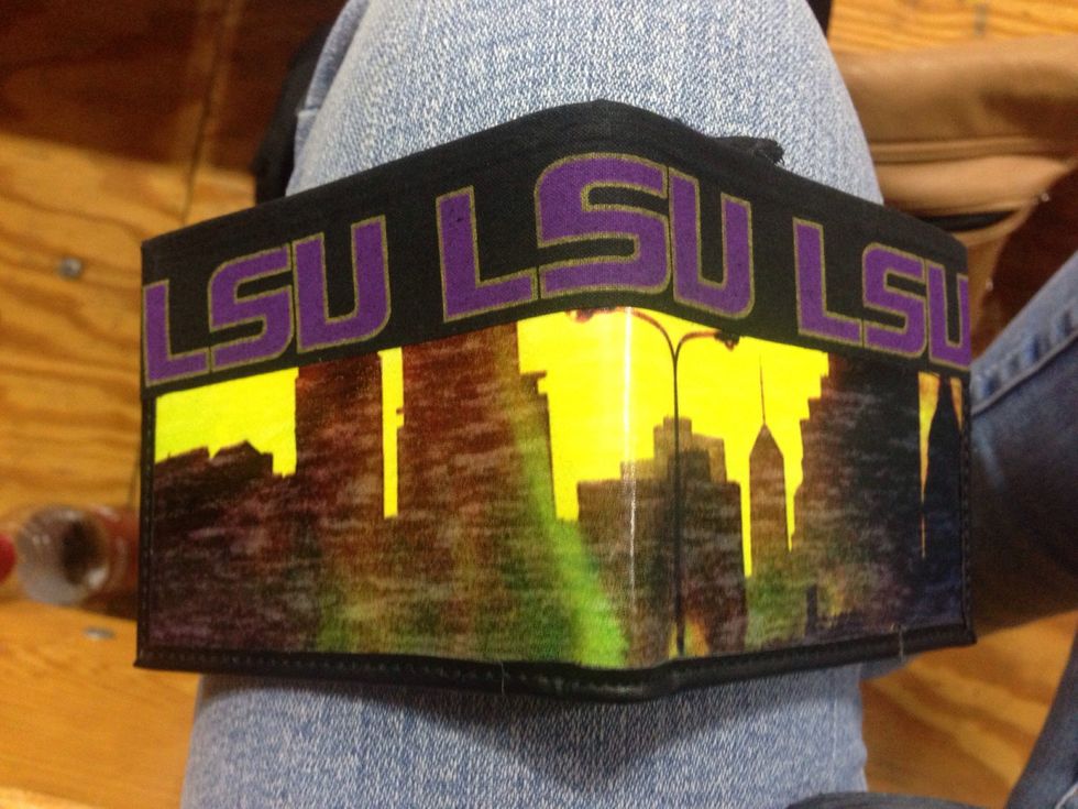 Put the first row of Signature Athletic Tape on top of wallet with ends just making it barely around edges so it keeps it neat on inside of wallet.