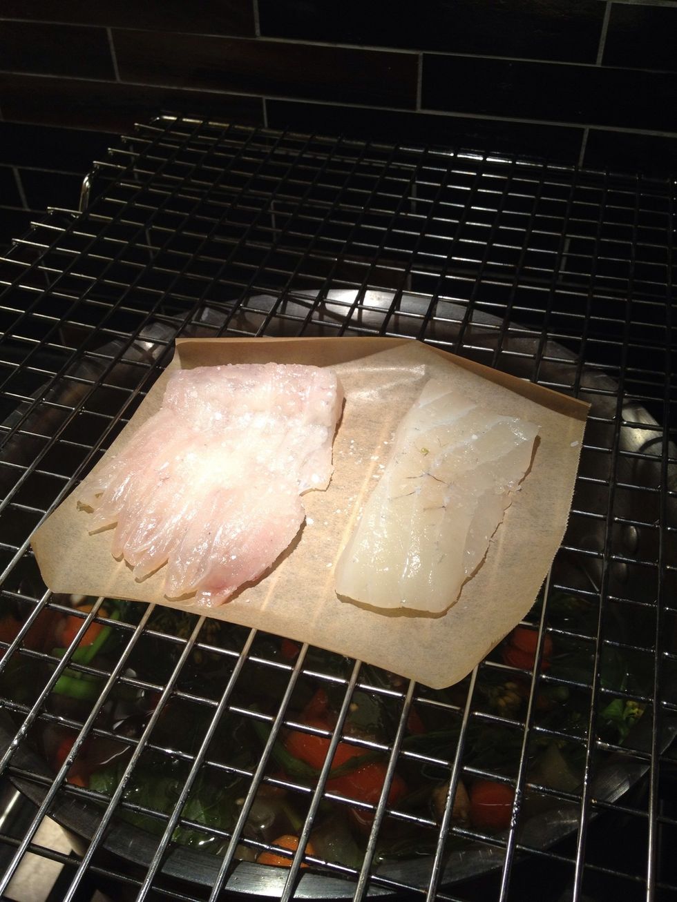 Put the fish on top of the rack. If you are making fish soup don't use the paper. So the juices get in there.