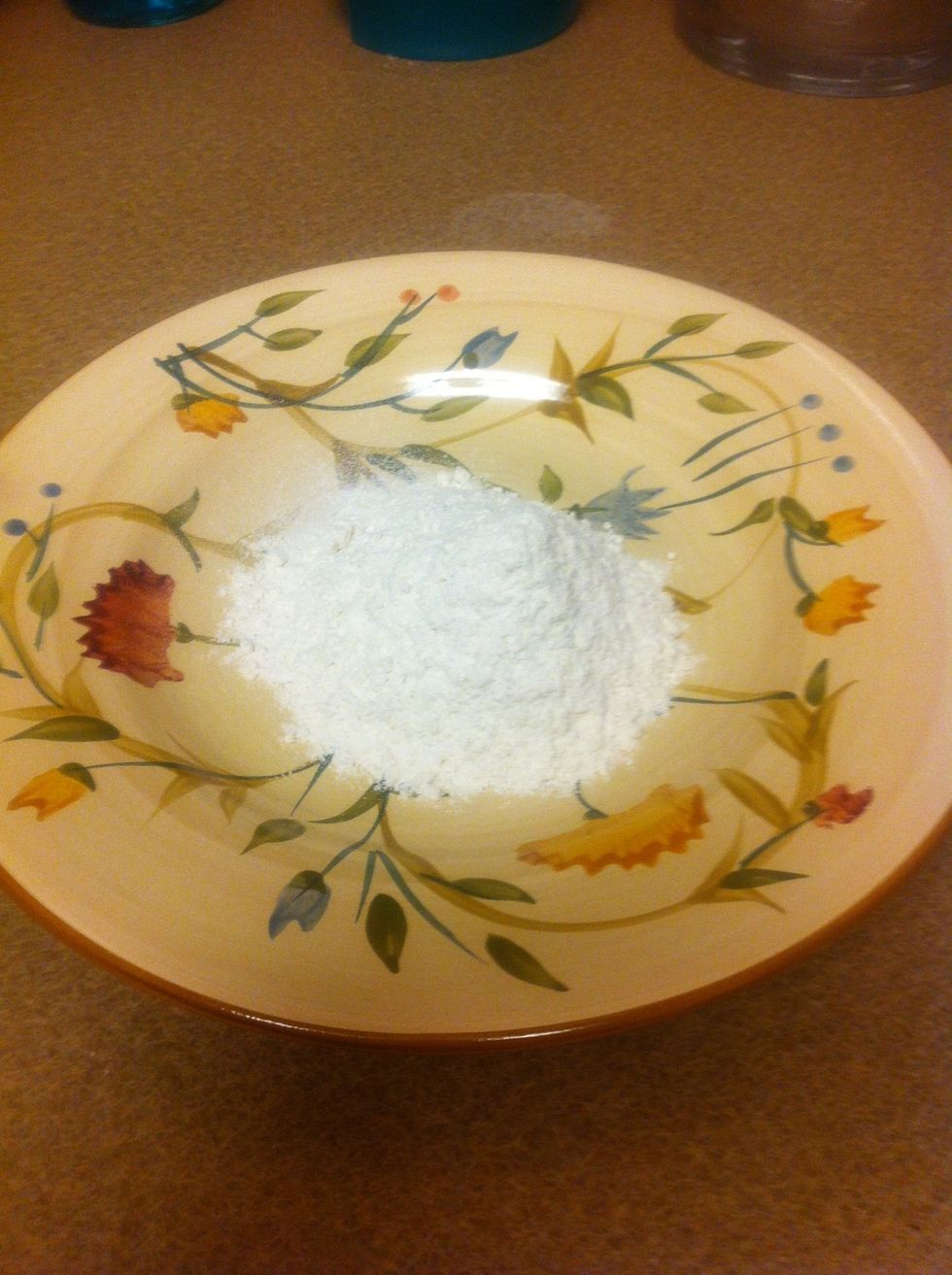 Put the flour on a plate mixed with a pinch of salt and pepper