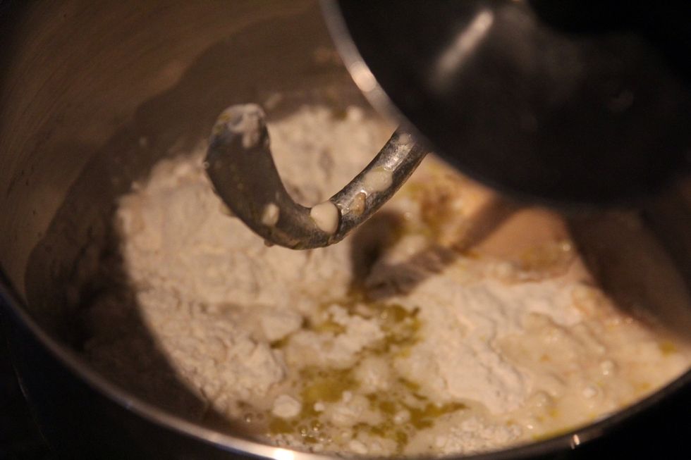 Put the flour, yeast, salt and water into a bowl and mix for ten minutes in a mixer. If you don't have one, tip onto a kitchen surface and knead for 10-15 minutes.