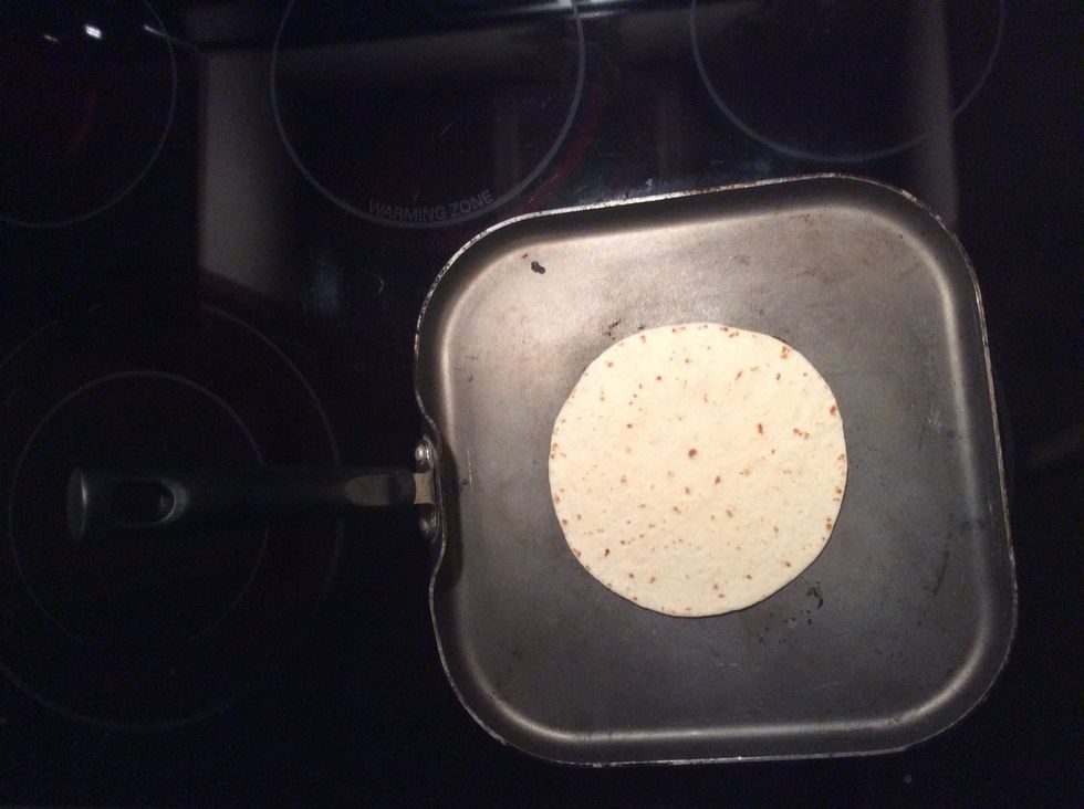 Put the flower tortilla in the comal