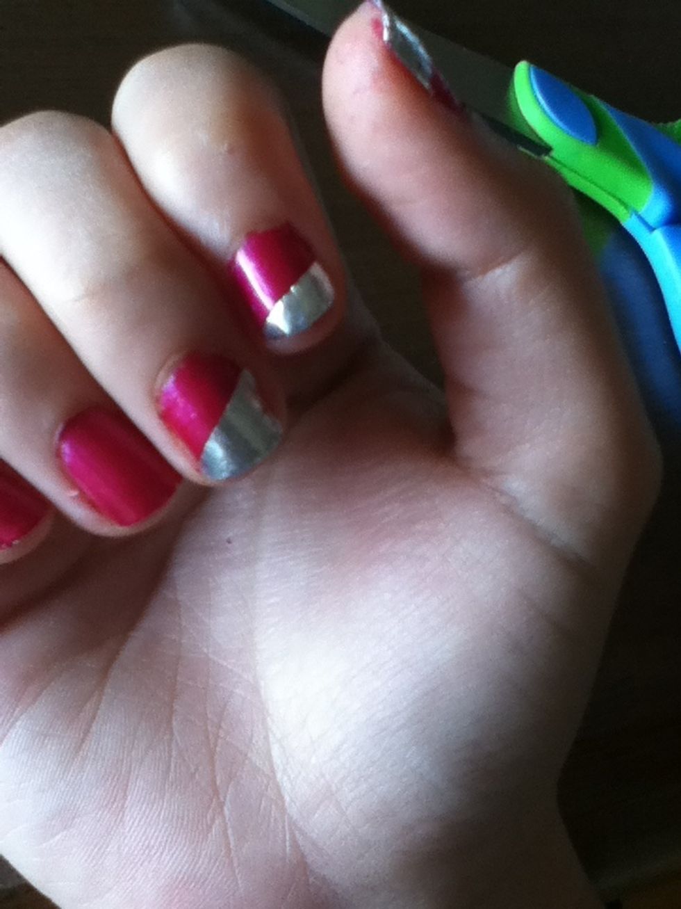 Put the foil on gently and press it in. At the very end, paint a top coat on your nails. And voila!