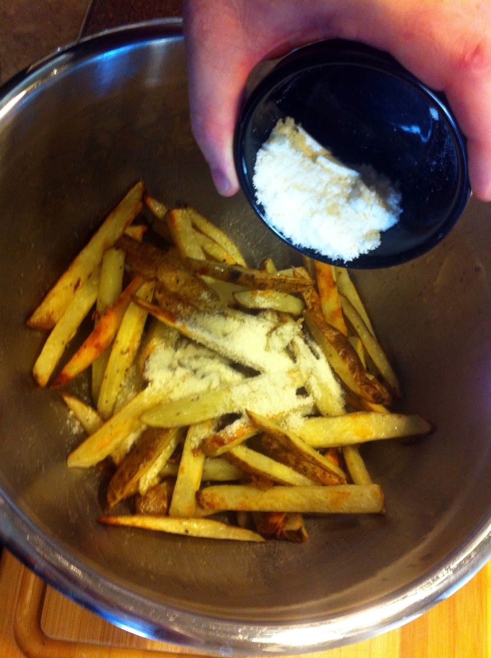 Put the fries back in the bowl, add the cheese...