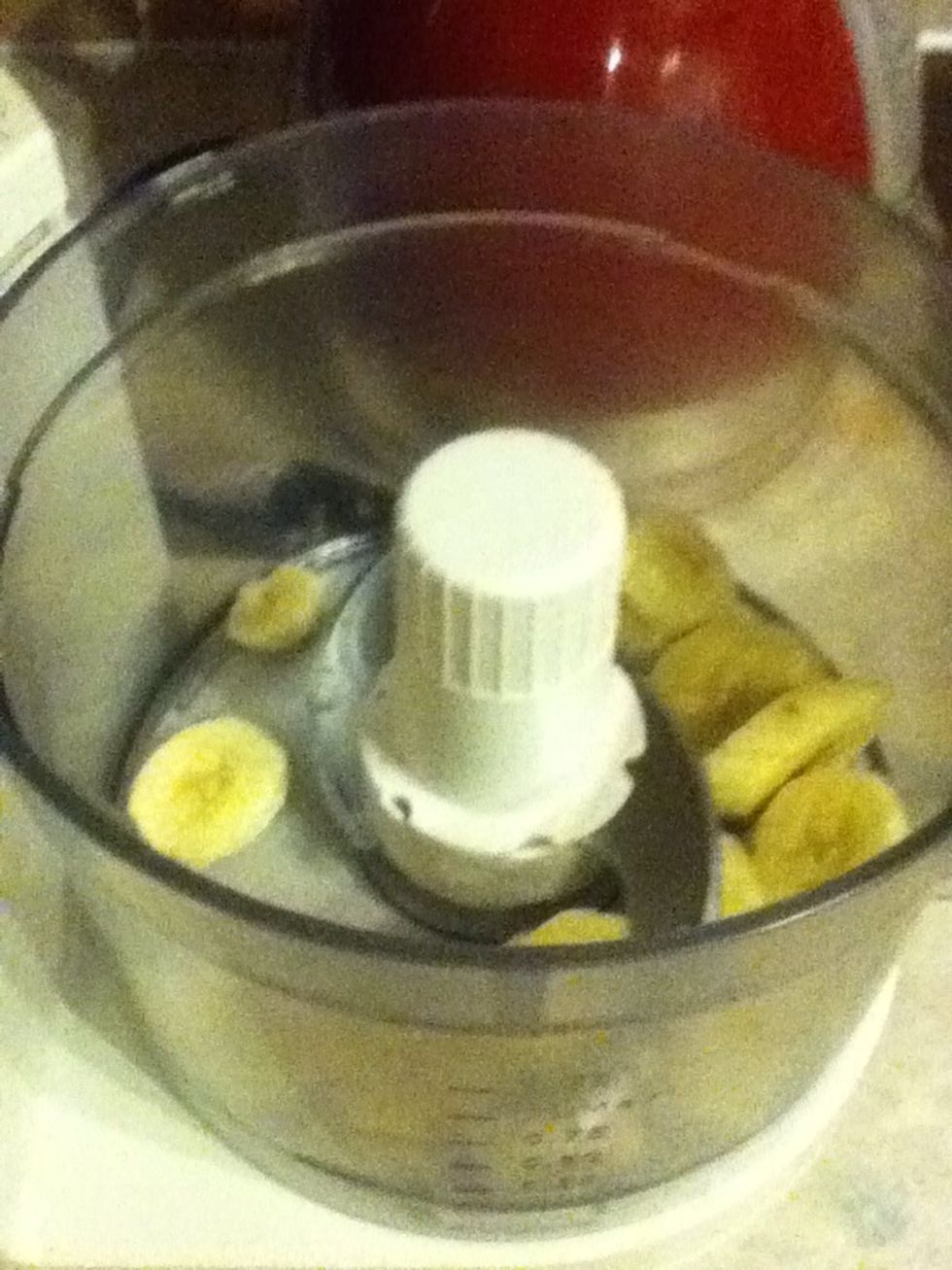 Put the frozen bananas into a food processor. I think you could use a blender instead, but mine didn't work and made a slightly scary noise when I tried to blend the bananas!
