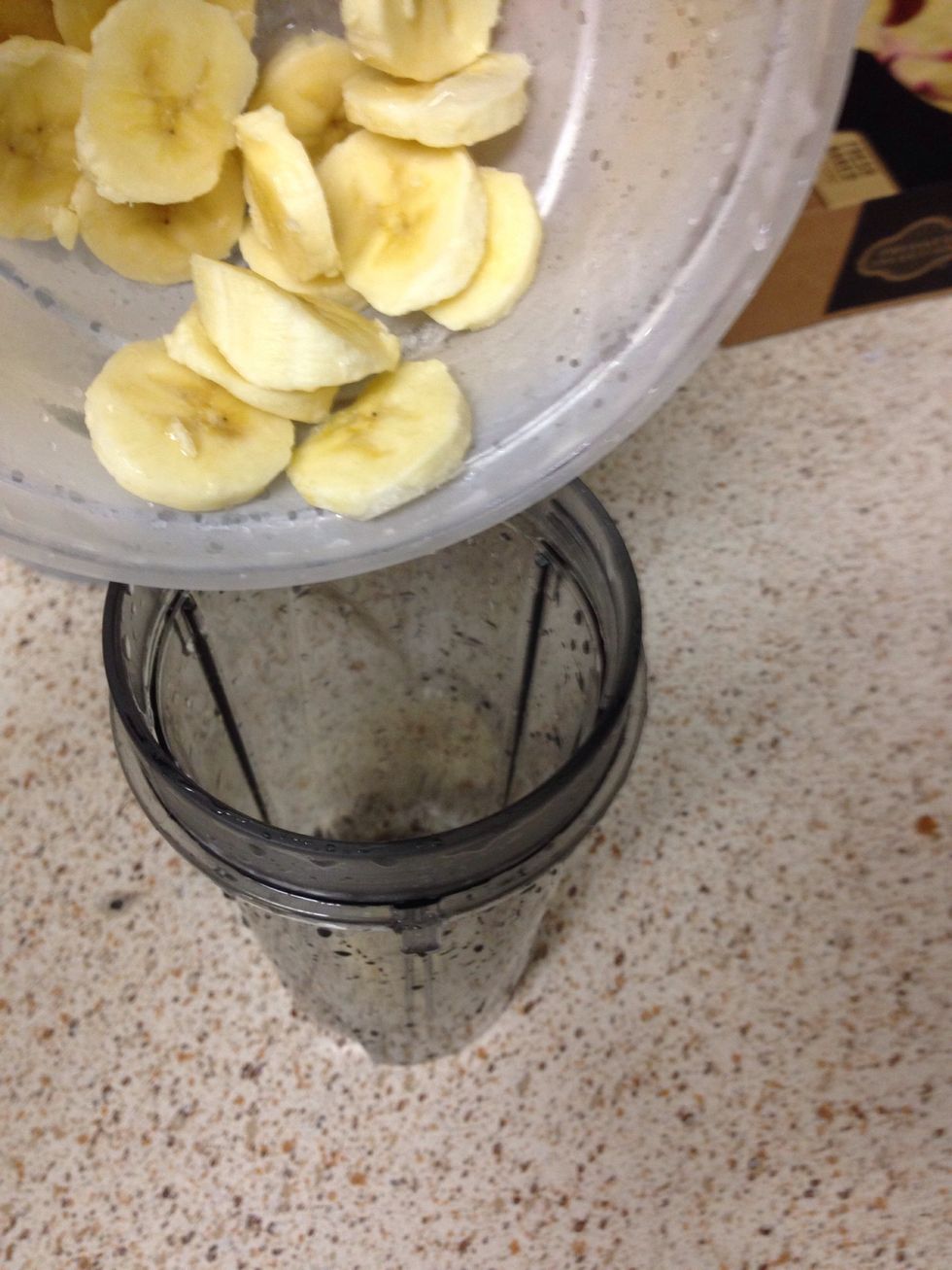 Put the frozen bananas into your blender.