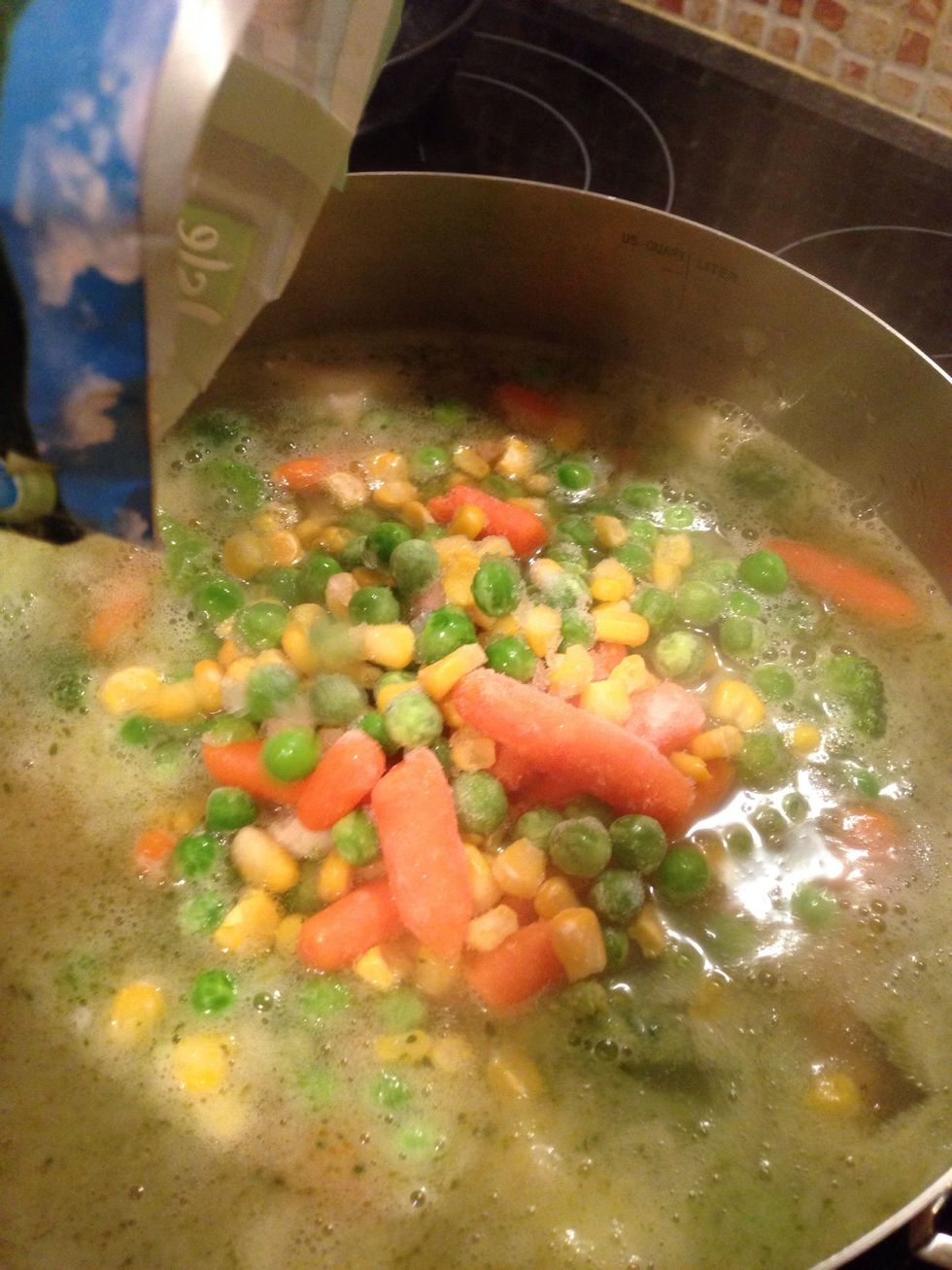Put the frozen veg in and wait for the soup to boil. It might take a good while this time.