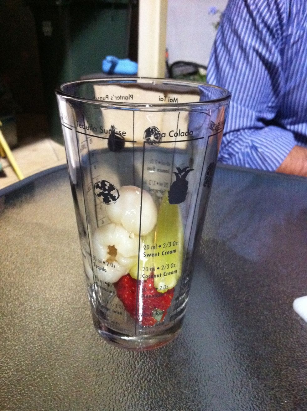 Put the fruit in your muddling cup.