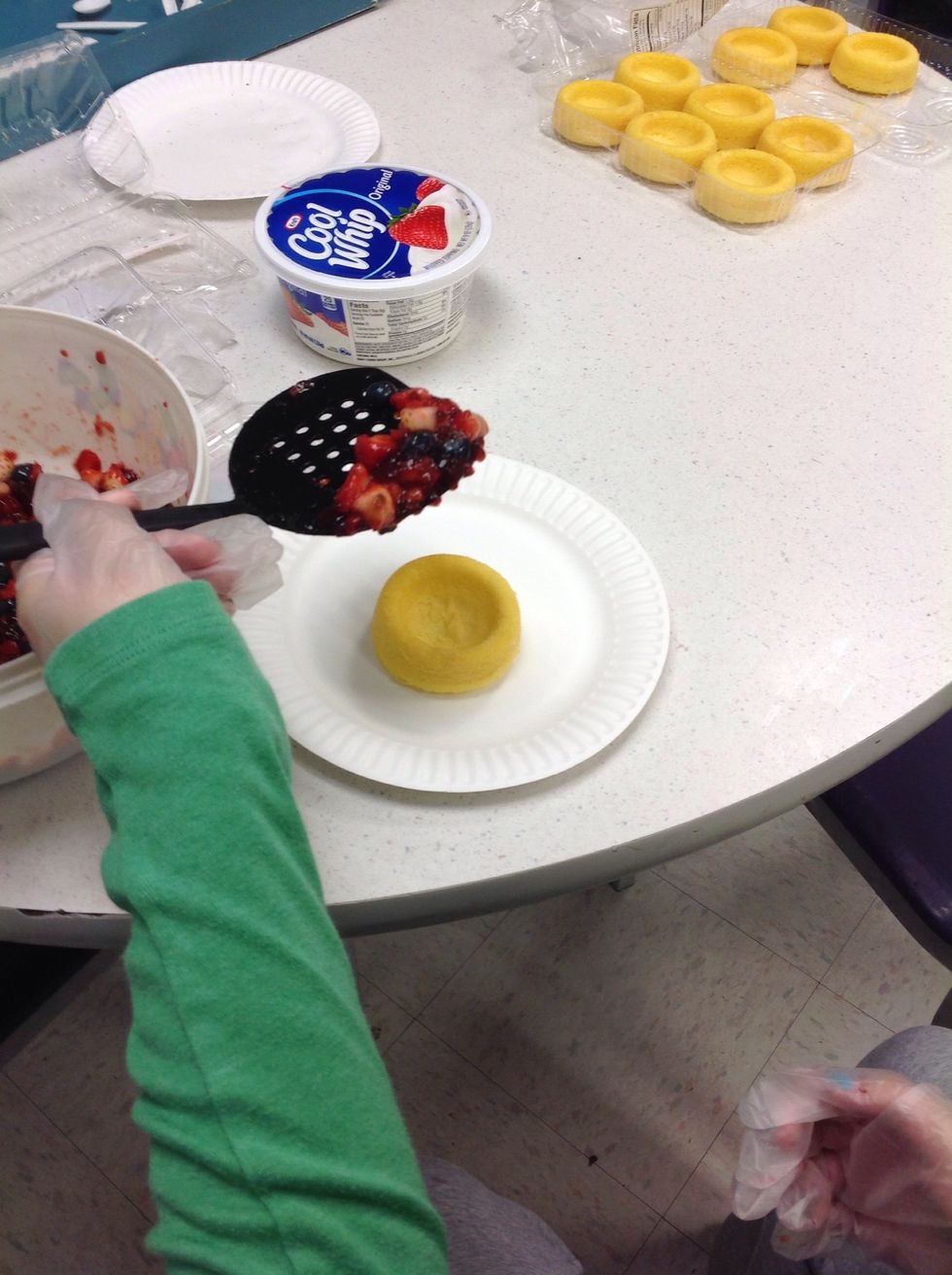 Put the fruit mix into the pound cake cups