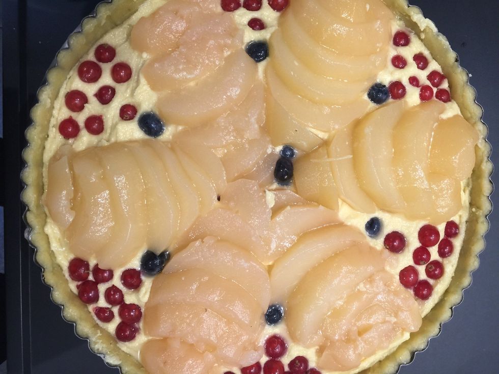 Put the fruits of your likings. I put poached pears and some berries. Bake in a preheated oven 180C 50 mins the sprinkle sugar on top and cook 10 more mins until golden