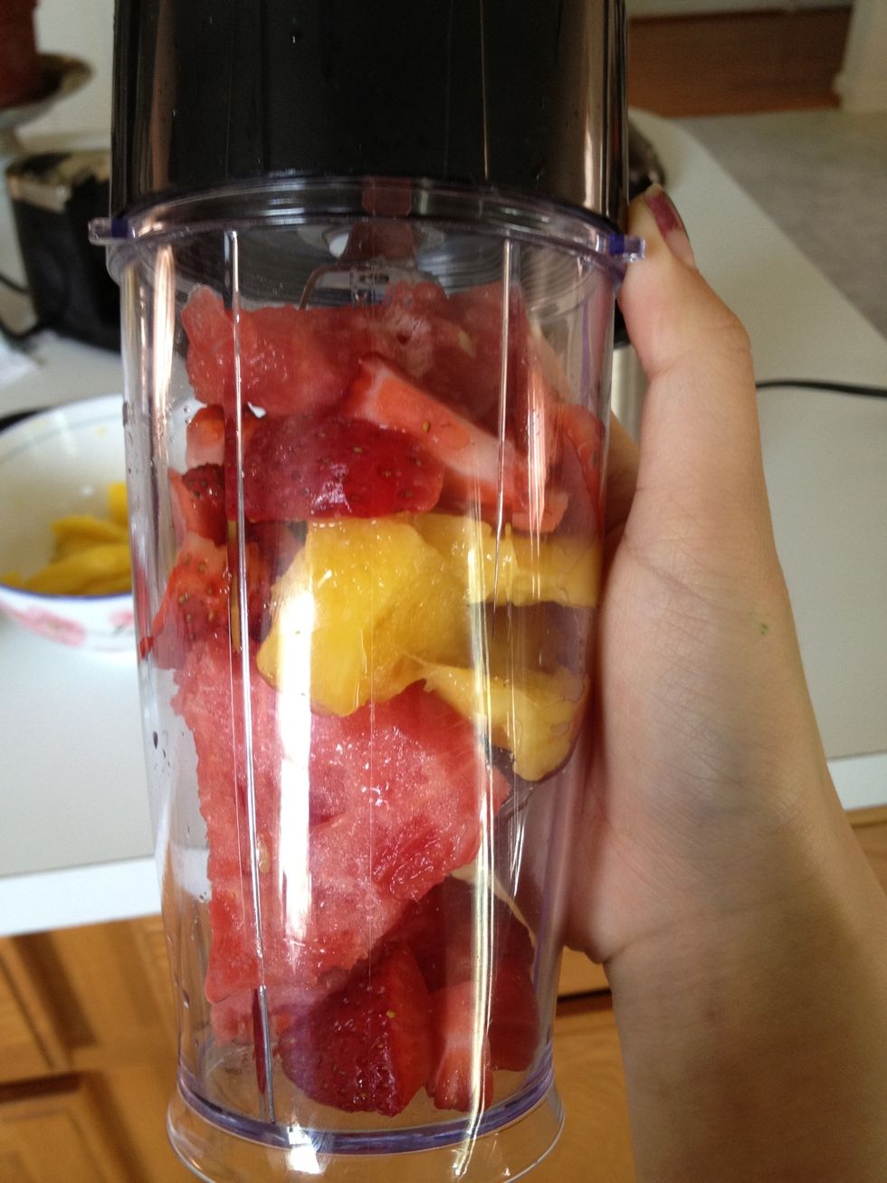 Put the fruits, whatever your heart desires into the cup. Can also add mint or sugar into the mixture, even crushed ice.