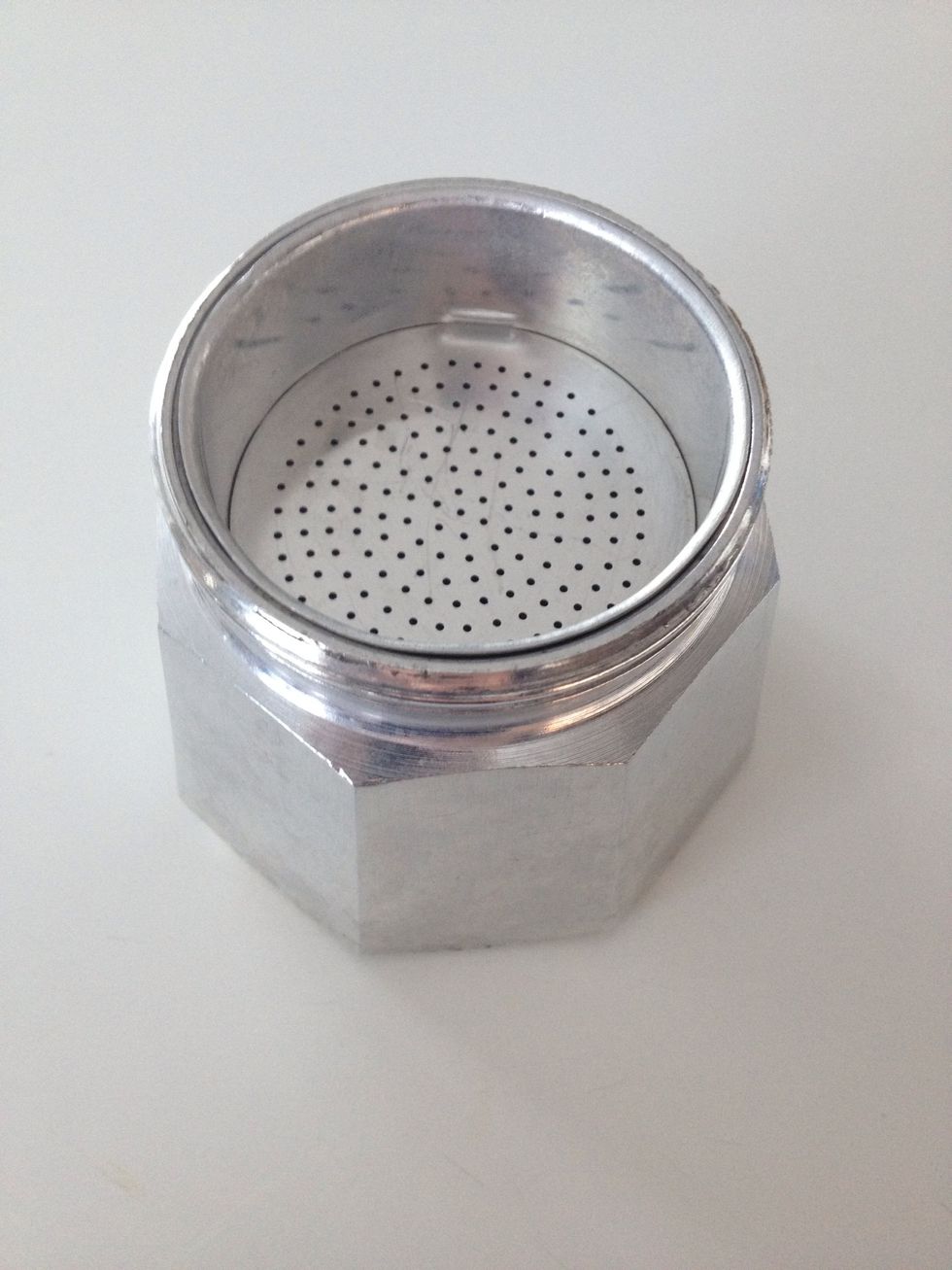 Put the funnel filter on top of the bottom chamber.