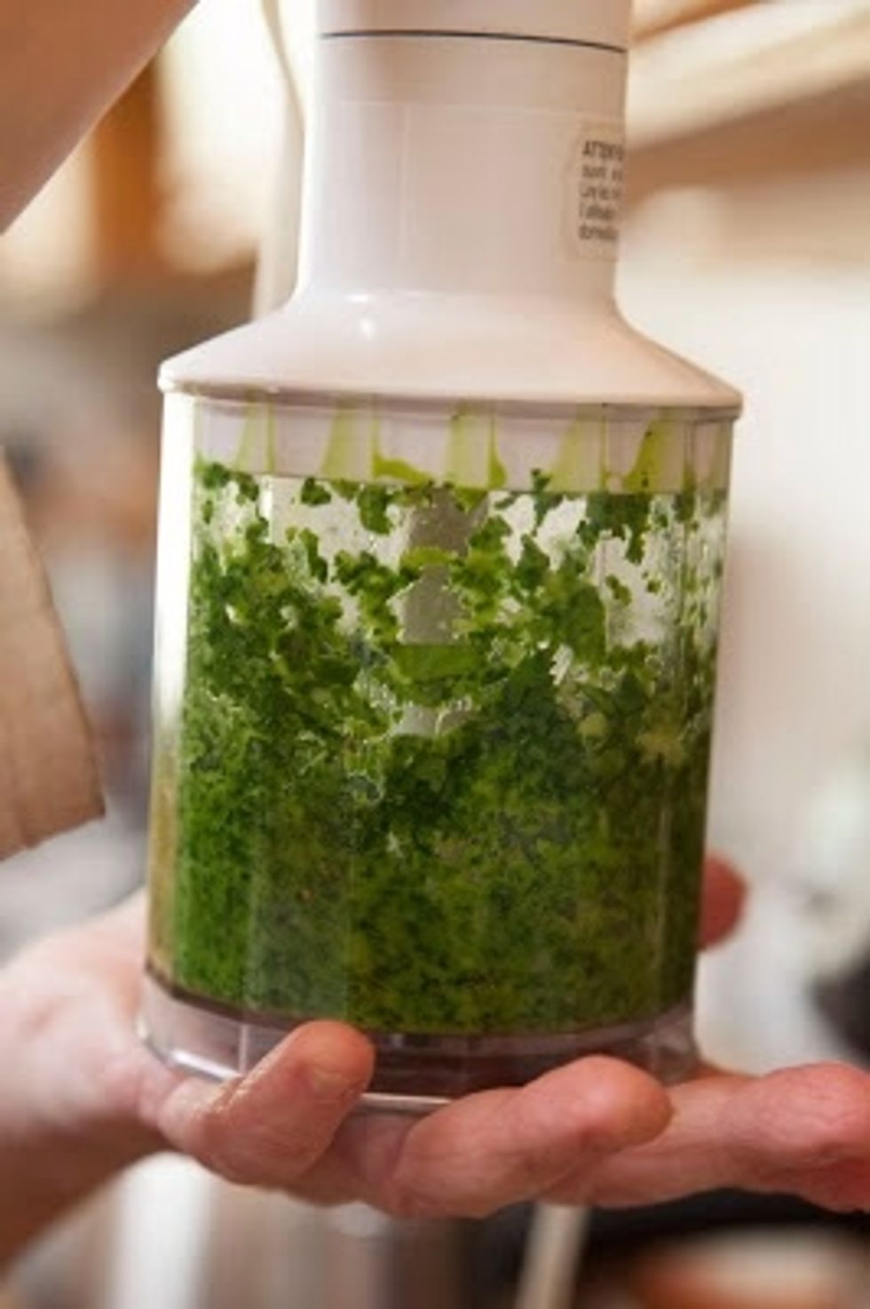 Put the ginger, shallot, cilantro and chilies in a grinder or blender. Add a little bit of water and grind them to a paste. Set the paste aside.