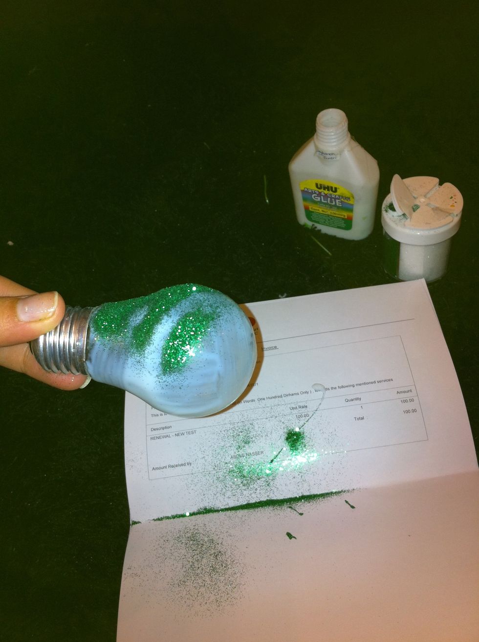 Put the glitter on the lamp and tie a string or ribon at the top of the lamp. Hang it somewhere and let let it dry.