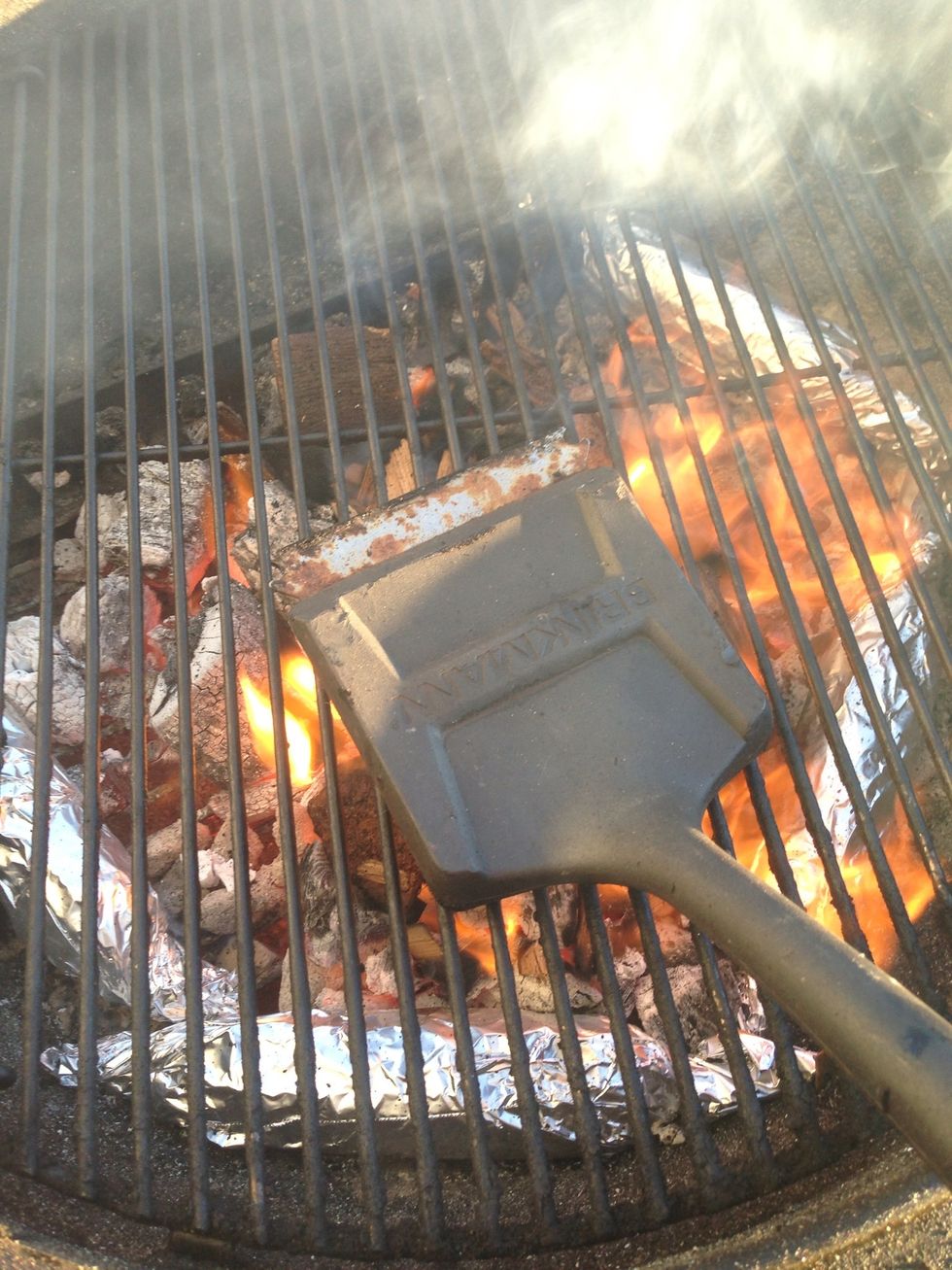 Put the grate on & give it a good scrub.