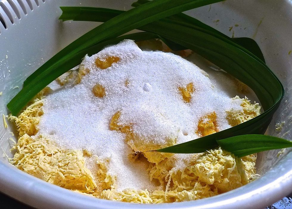 Put the grated tapioca into a large mixing bowl. Add the reserved tapioca starch. Then add sugar, beaten eggs and salt. Stir well until the sugar is dissolved.