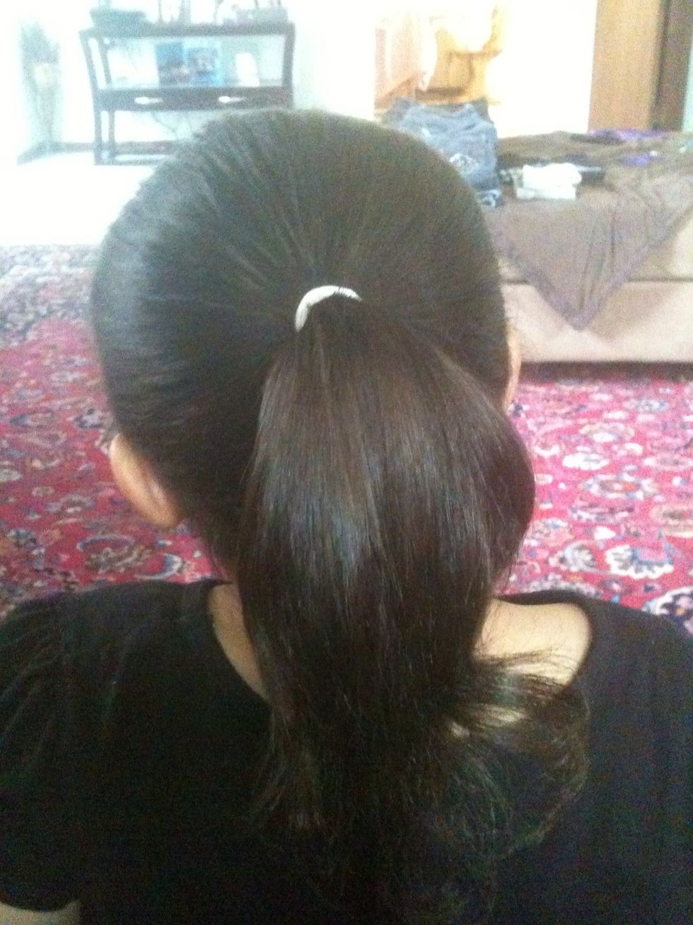 Put the hair in a nice ponytail with no bumps or stragglers