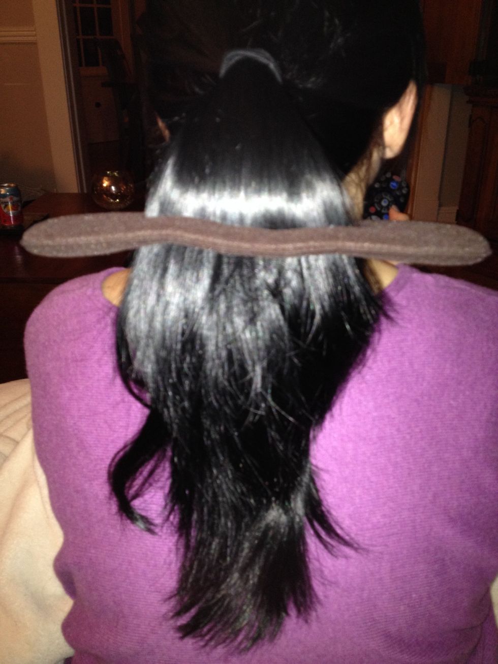 Put the hair in the slit in the bun maker, pull all the way down your hair and start rolling