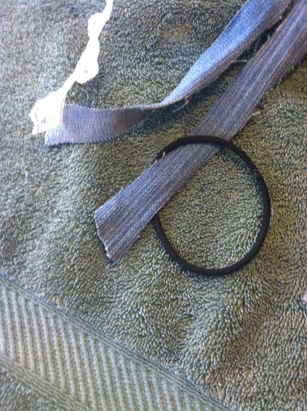 put the hair tie around on piece of fabric