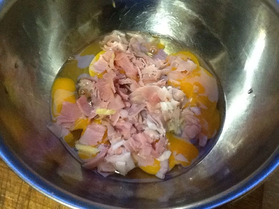 Put the ham in the bowl with the eggs.