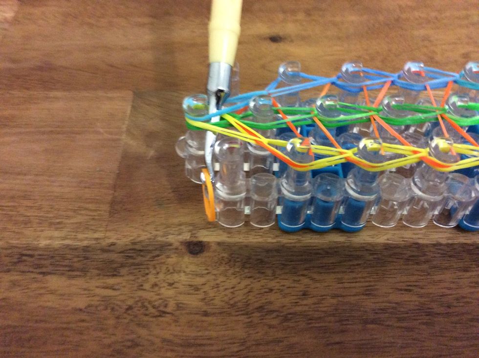 Put the hook under the looms