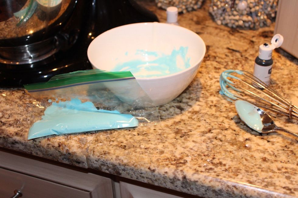 Put the icing into one small plastic bag