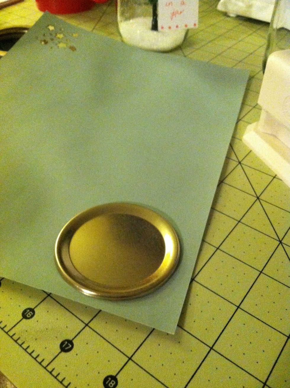 Put the inside part of the lid on your paper or card. Trace around and cut out.