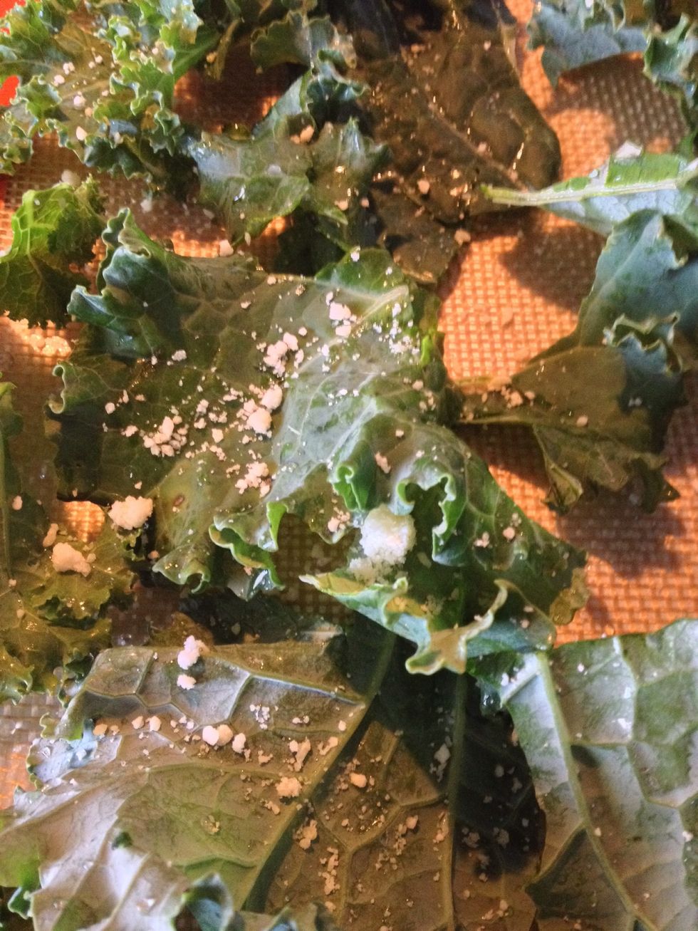 Put the kale on the silpat mat and not use oil.  Sprinkle the Parmesan cheese and put it in the oven.