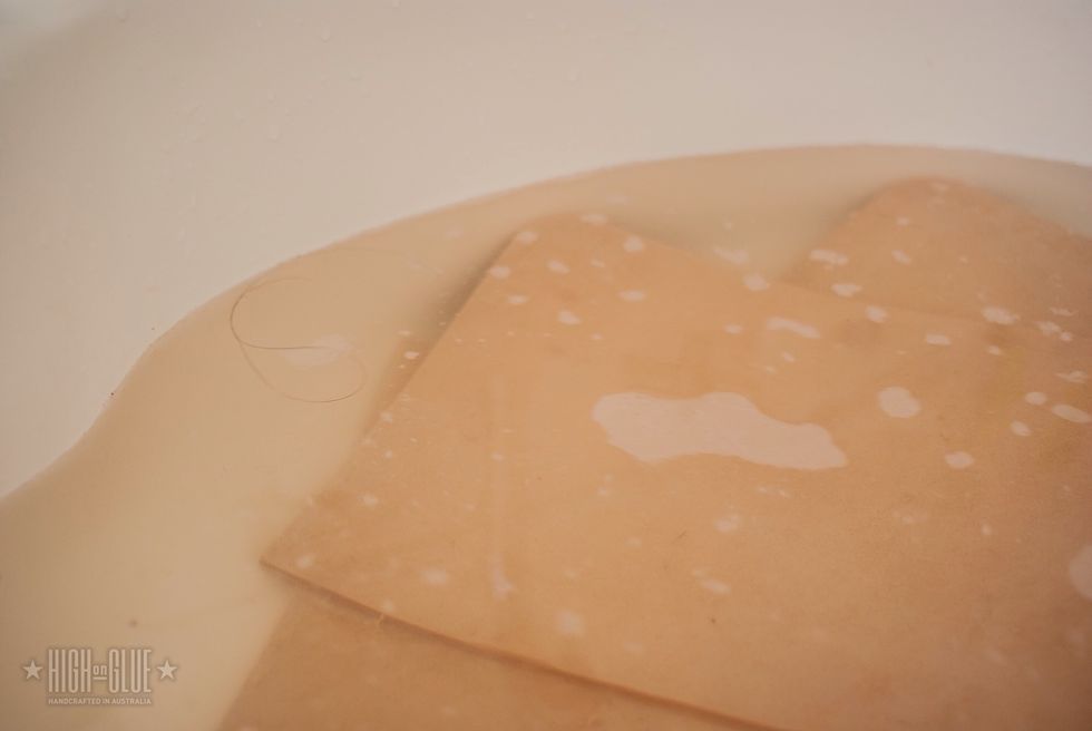 Put the leather in water for a bit and get it out to dry. While it dries it'll reach a point where it'\u0080\u0099s almost completely dried through and it'll be ready for embossing.