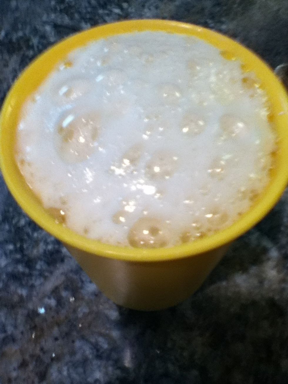 Put the lemon juice and the baking soda together in the cup and mix. Don't be alarmed if it bubbles over just keep mixing!!:)