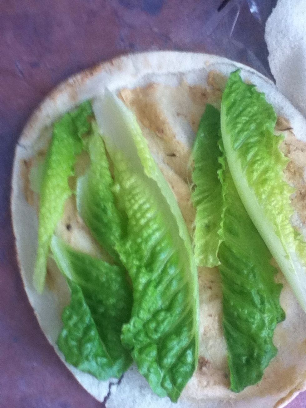 Put the lettuce on the pita