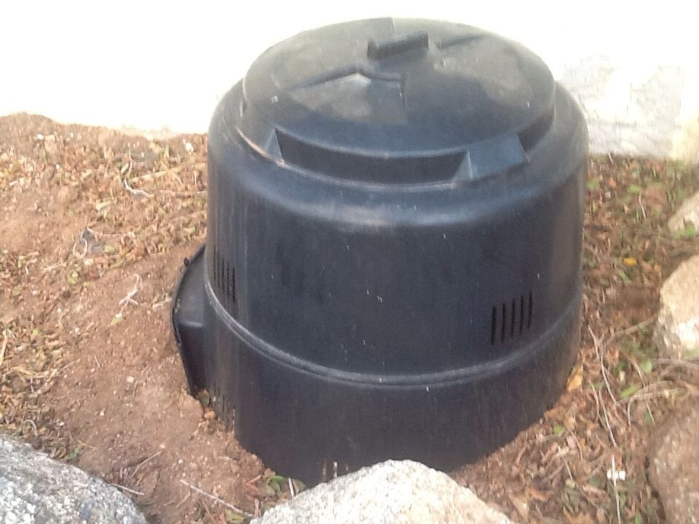 Put the lid back on top. Notice the aeration strips. You need scrap, air, and water to get the job done. There are great bugs who will go to work on your garbage to break it down.
