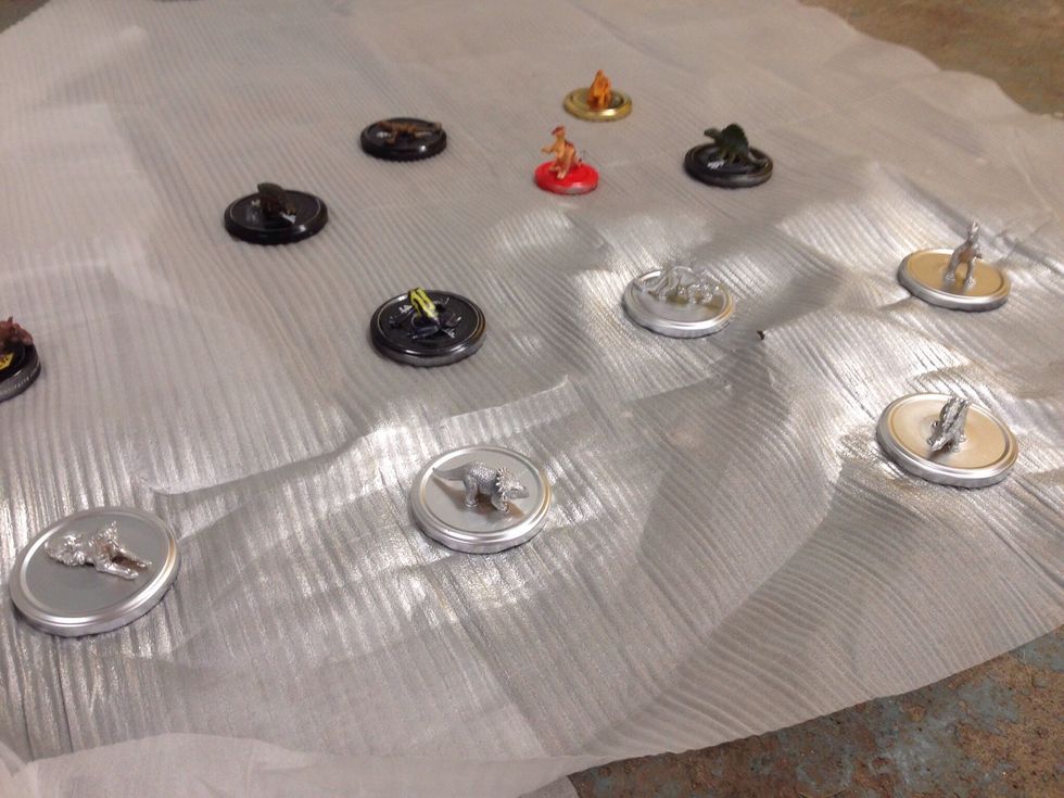 Put the lids on some kind of cover, preferably you should be outside. The smell is strong! Then you just spray away! From all angles.