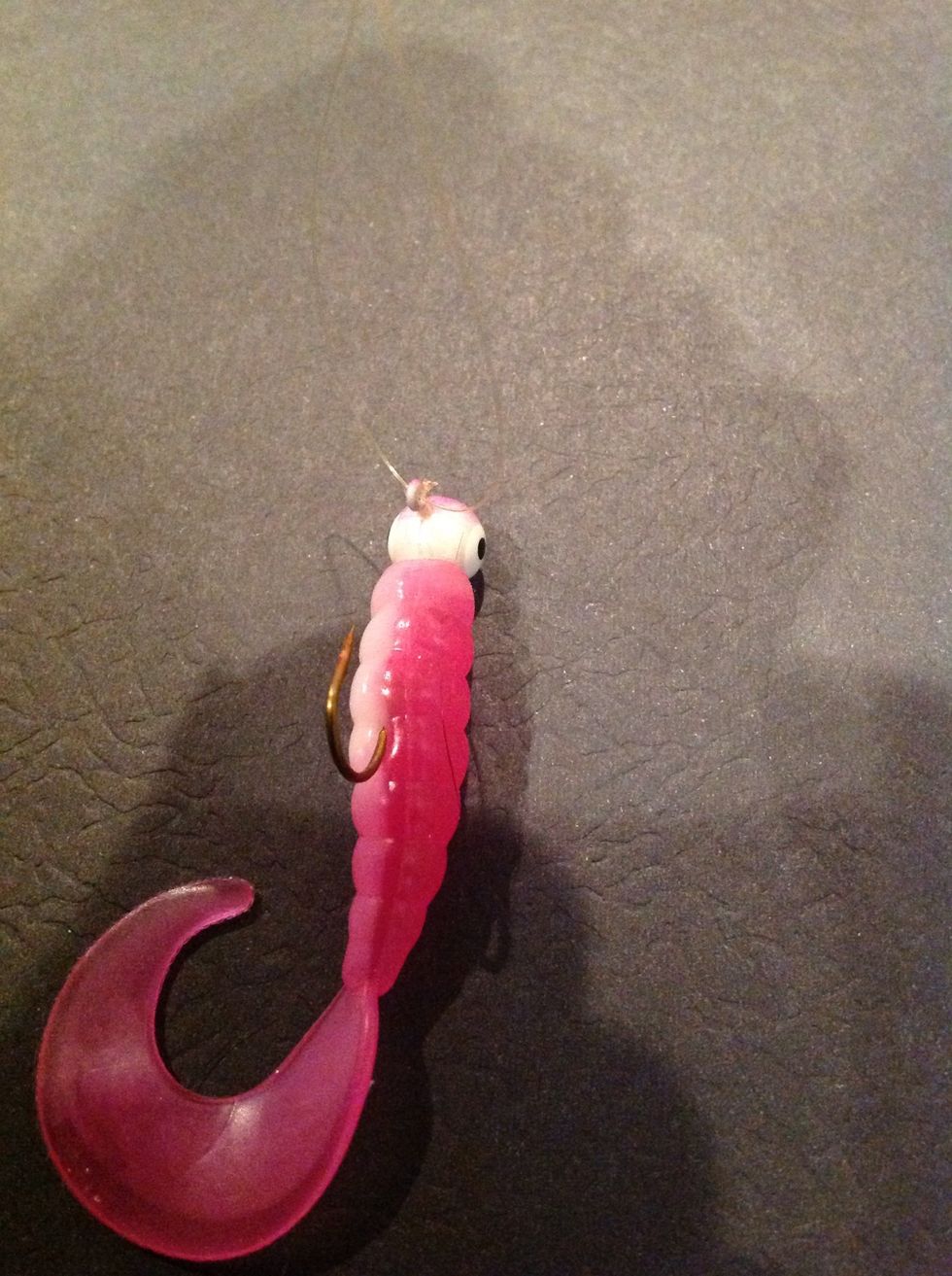 Put the line though the eye of the hook and pull it through about 4 inches.