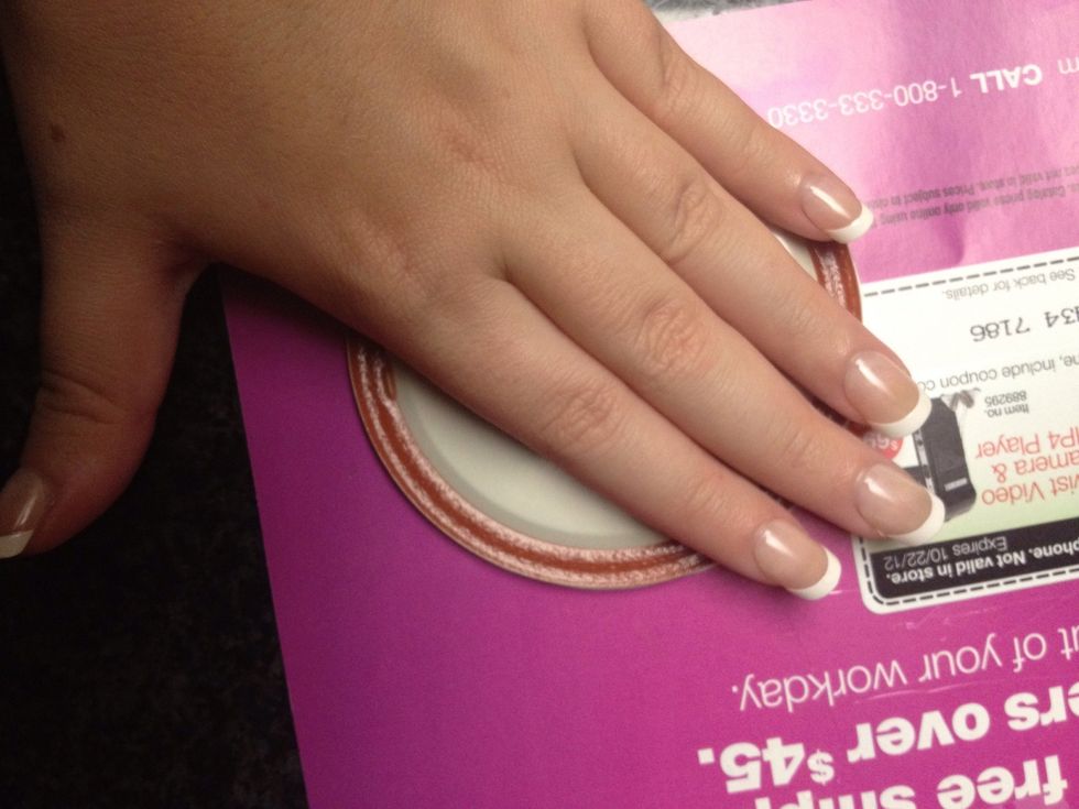 Put the mason jar lid, magnet side up, onto the hot glue you just put down and PUSH!